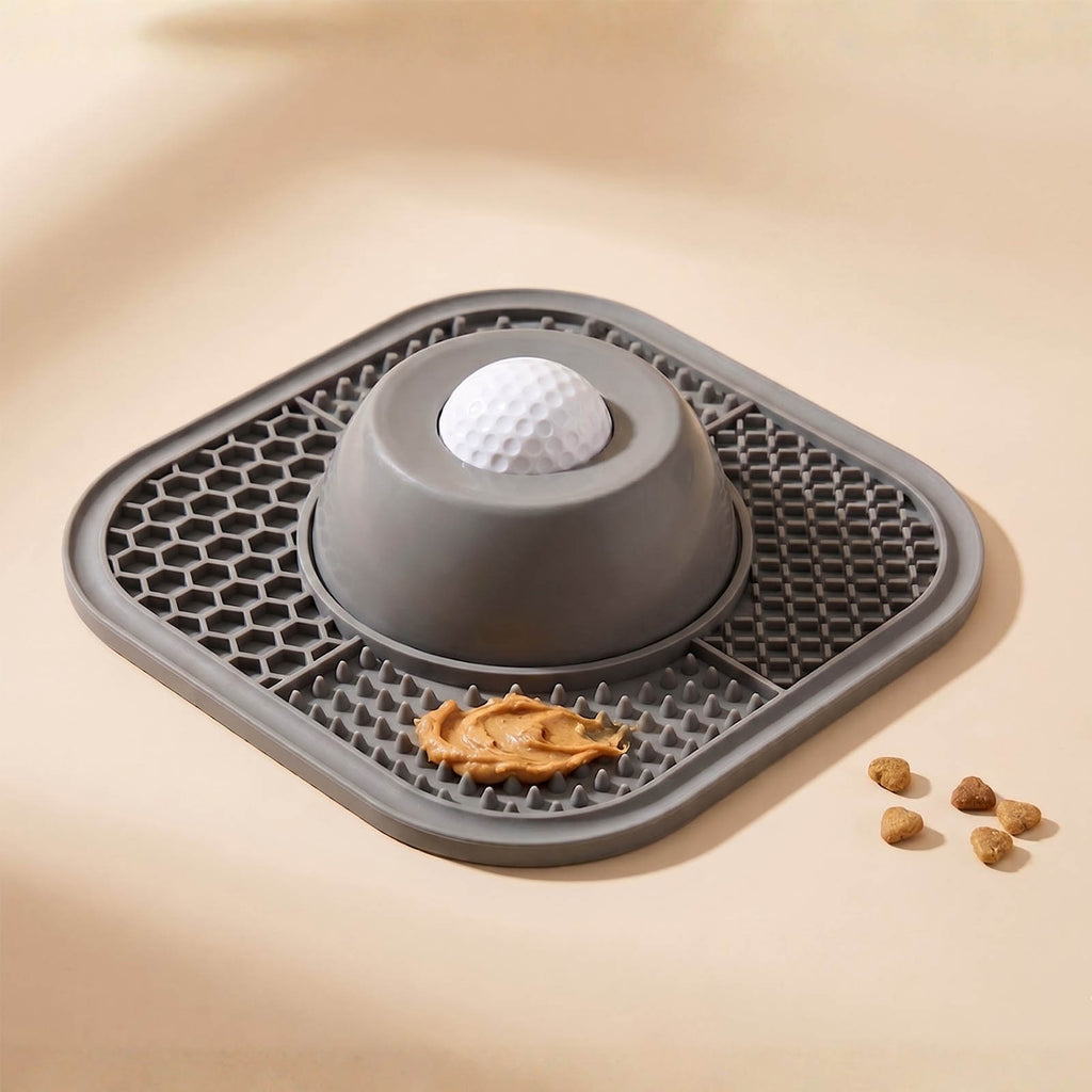 Gray pet mat with a ball and treats on a beige background