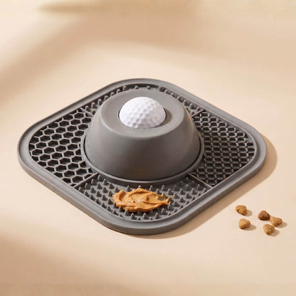 Gray pet mat with a ball and treats on a beige background