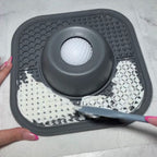 Gray silicone mat with textured design on a light gray background