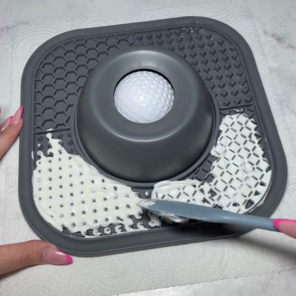 Gray silicone mat with textured design on a light gray background